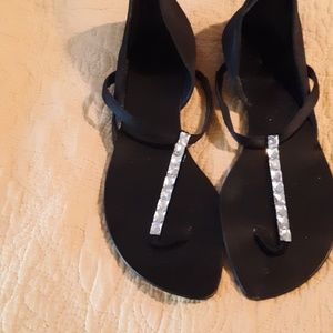 Black satin leather and rinestone thong sandals.